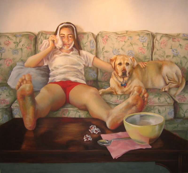 Girl with dog on floral couch