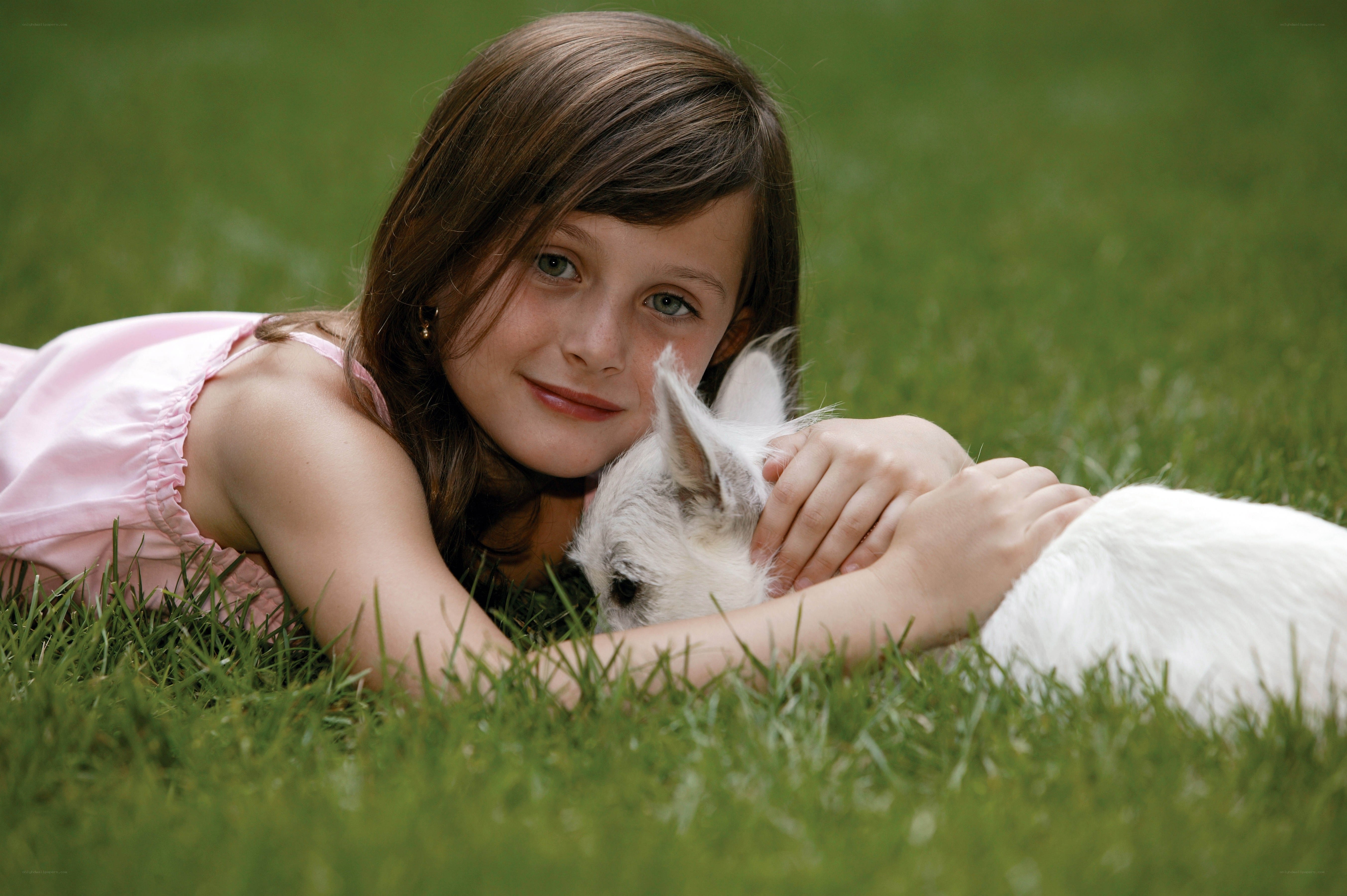 Girl with dog on grass