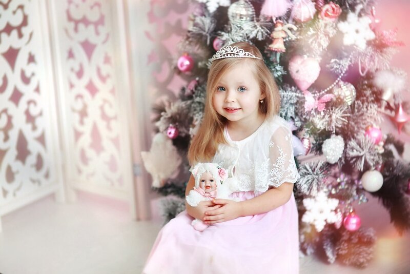 Girl with Doll in Front of Tree