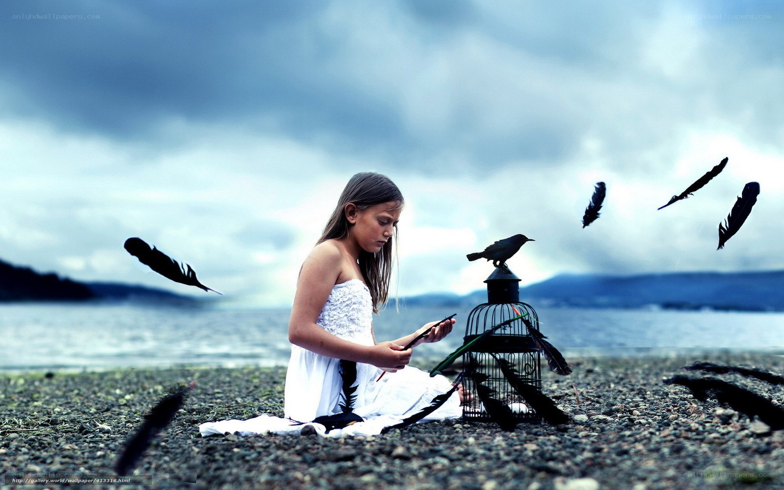 Girl with feathers on beach