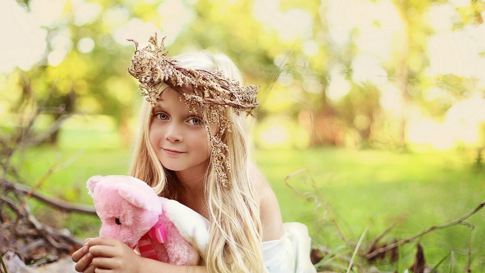 girl with flower crown and teddy bear