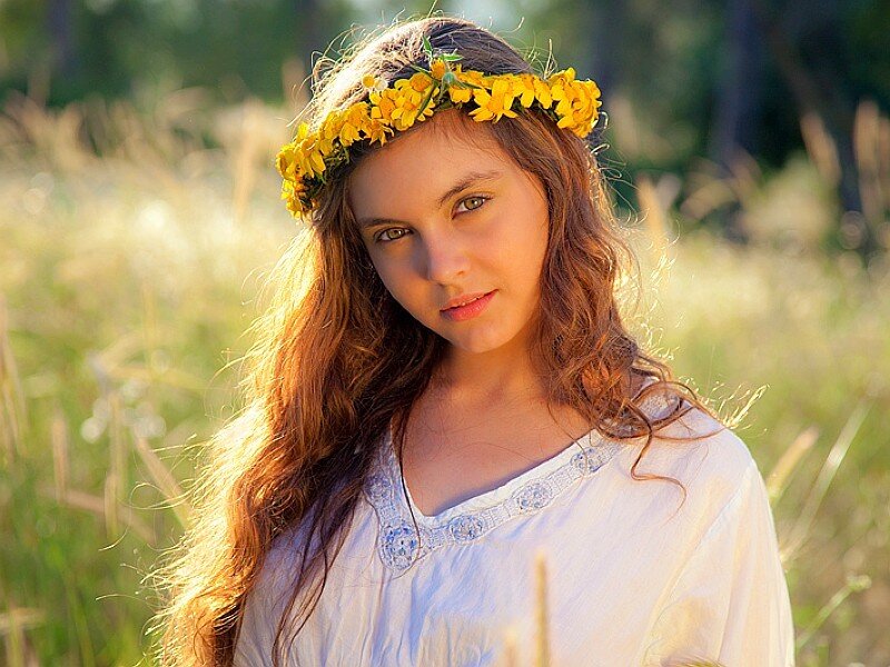 girl with flower crown in field