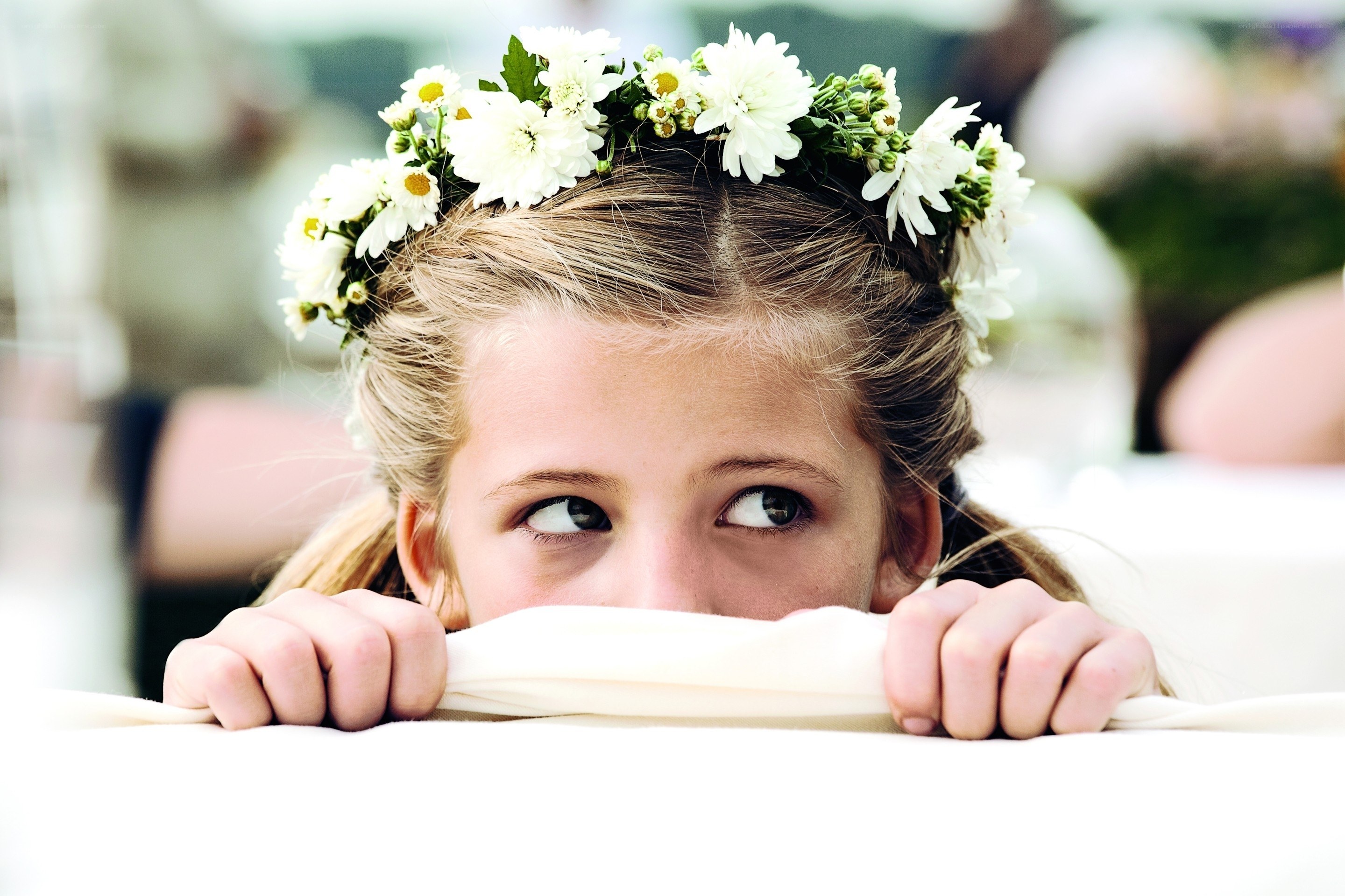 girl with flower crown peeking