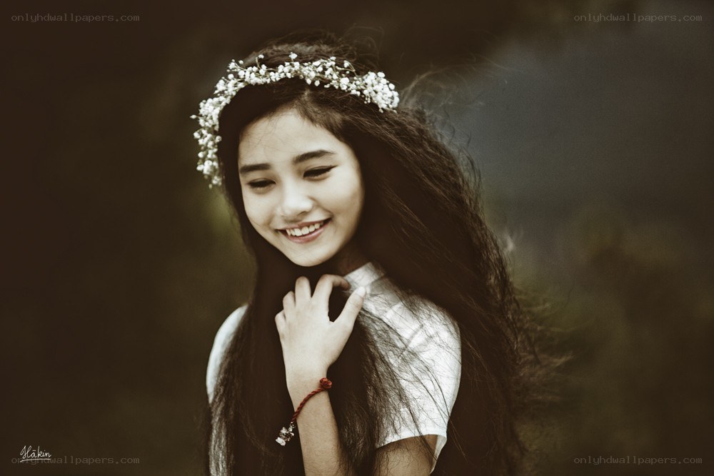 girl with flower crown smiling