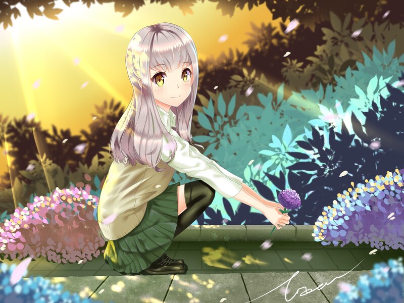 Girl with flower in garden