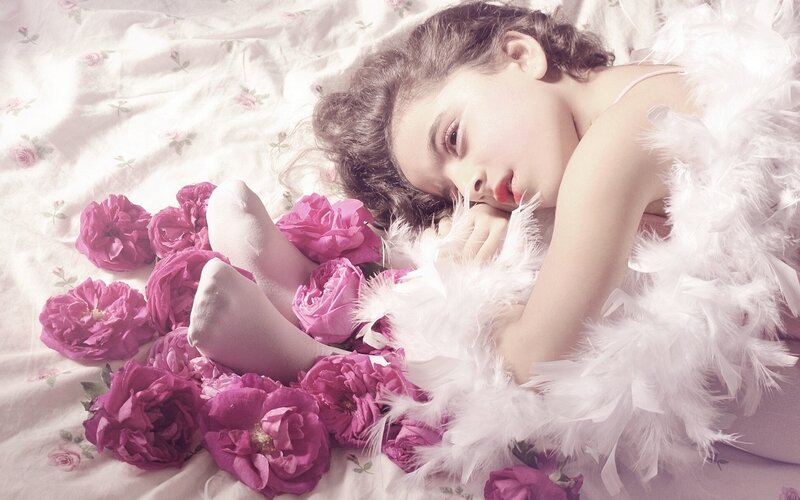girl with flowers and feathers