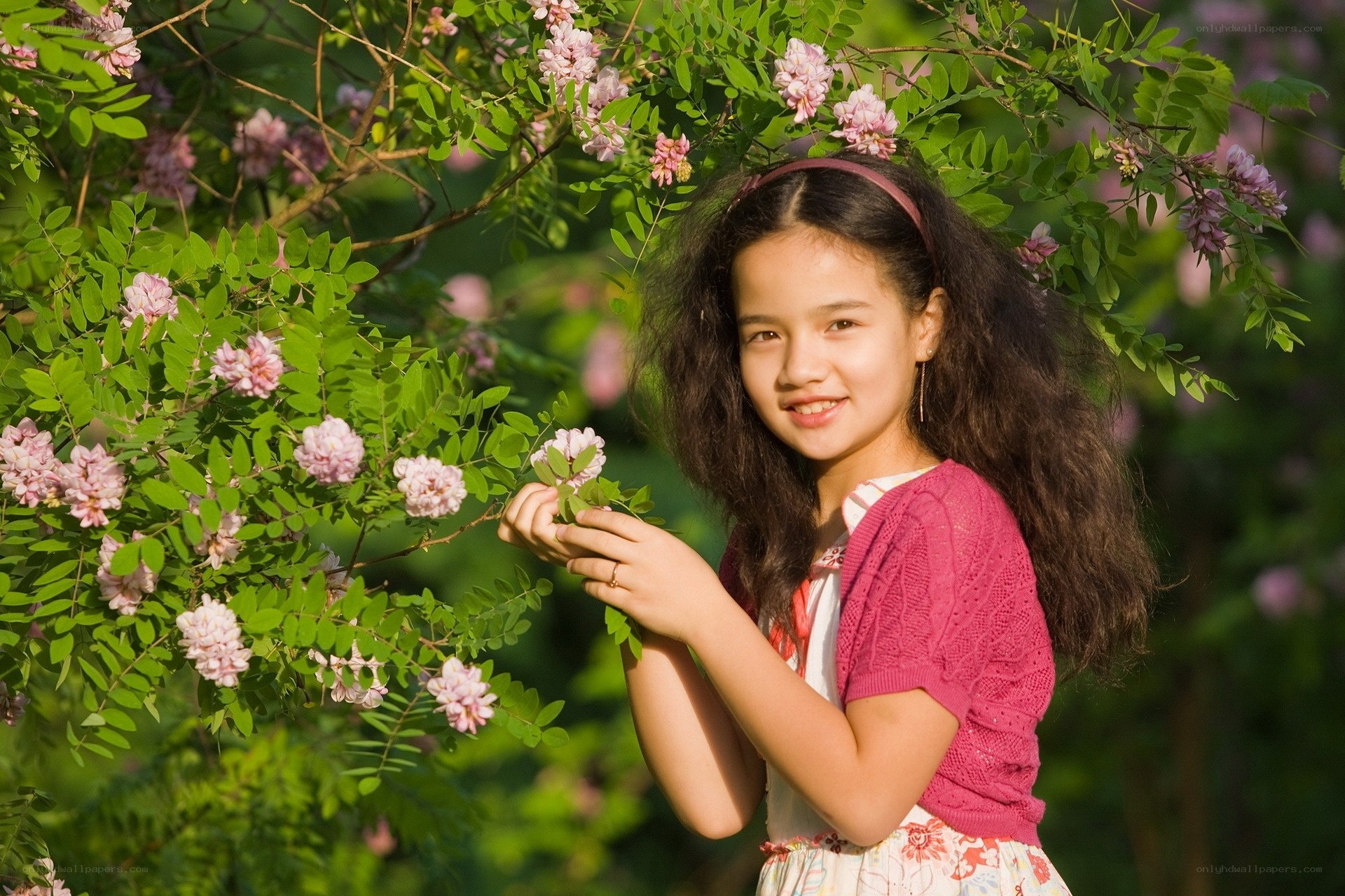 Girl with flowers in garden