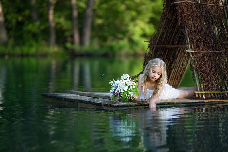 Girl with Flowers on Raft