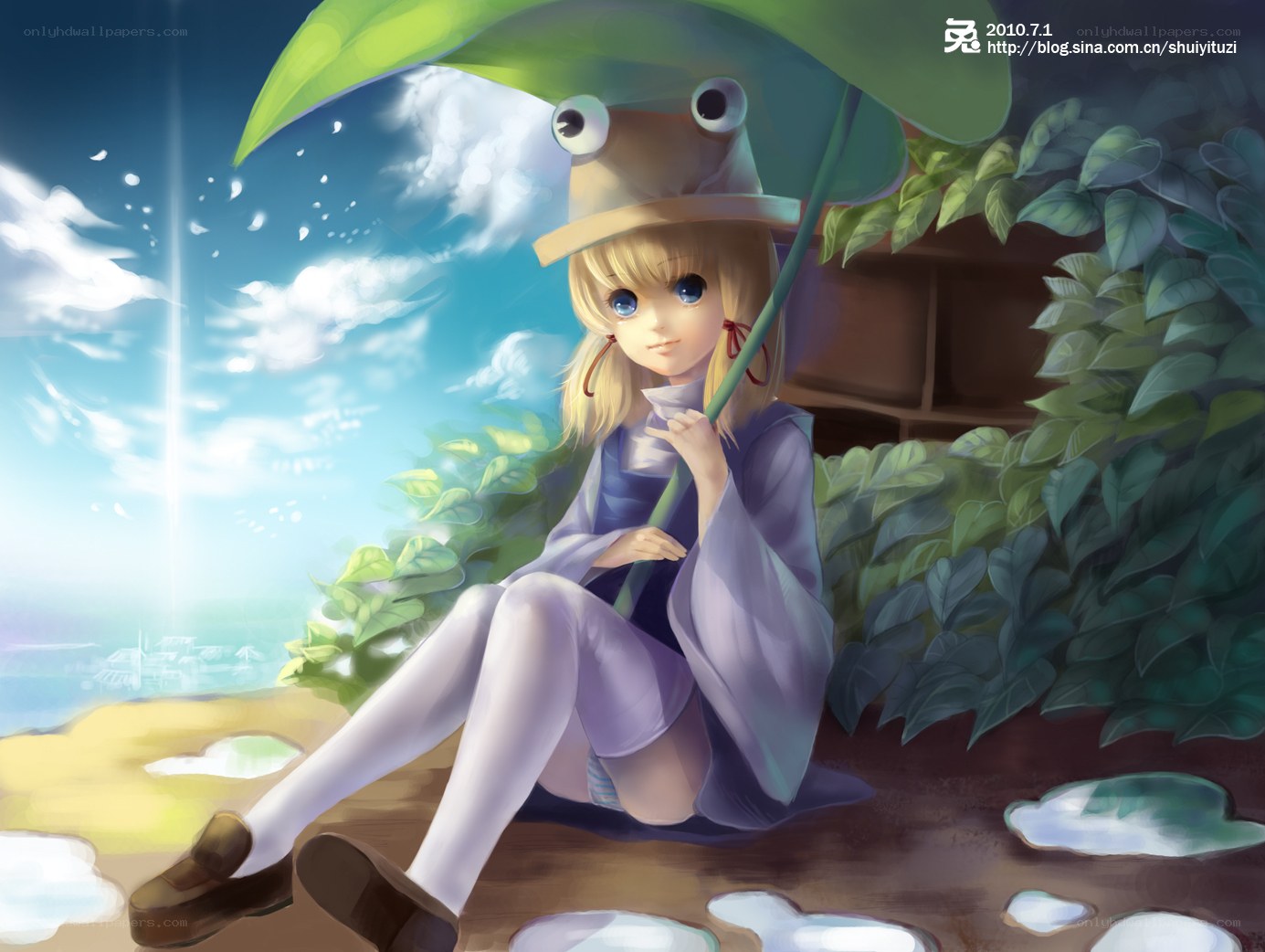 girl with frog hat under leaf