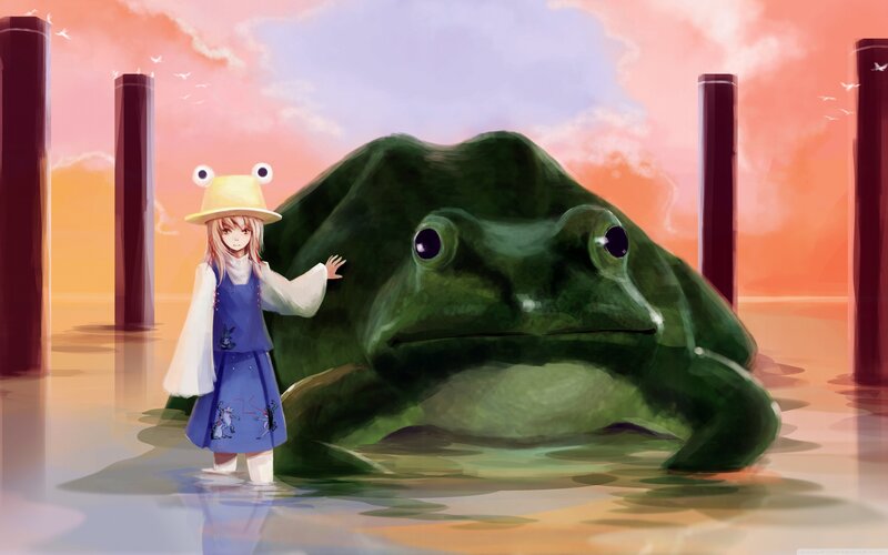 Girl with giant frog at sunset