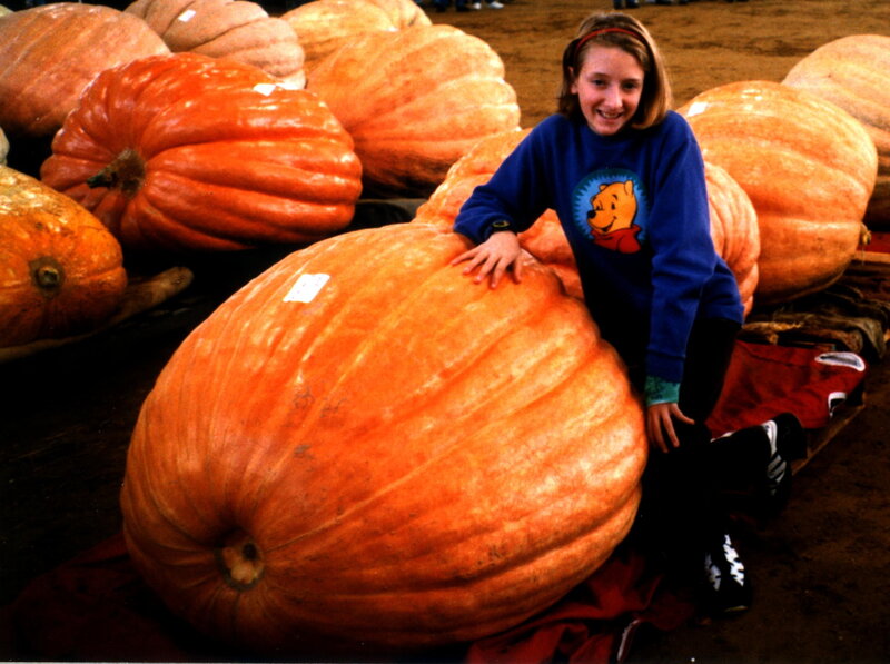 Girl with giant pumpkin