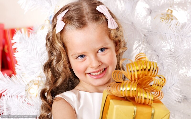 girl with gift near white tree