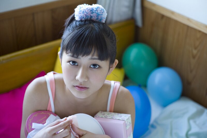girl with gifts and balloons