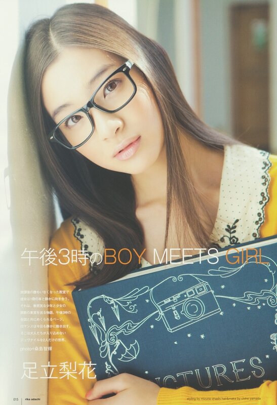Girl with glasses holding a book