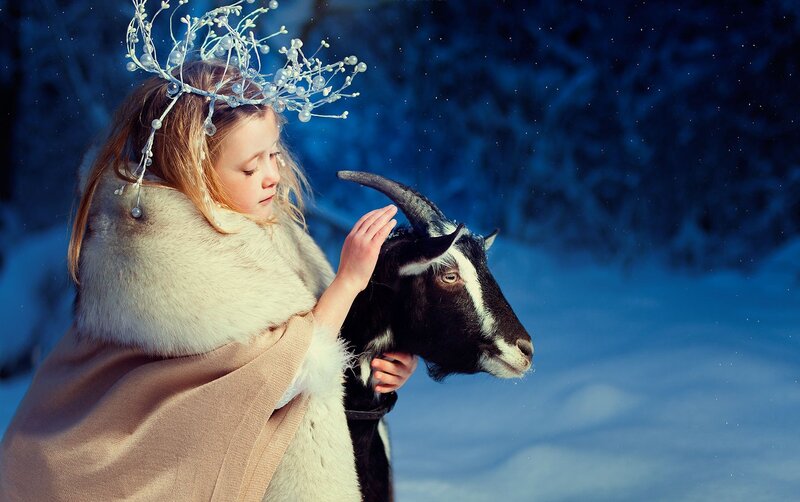 Girl with Goat in Snow