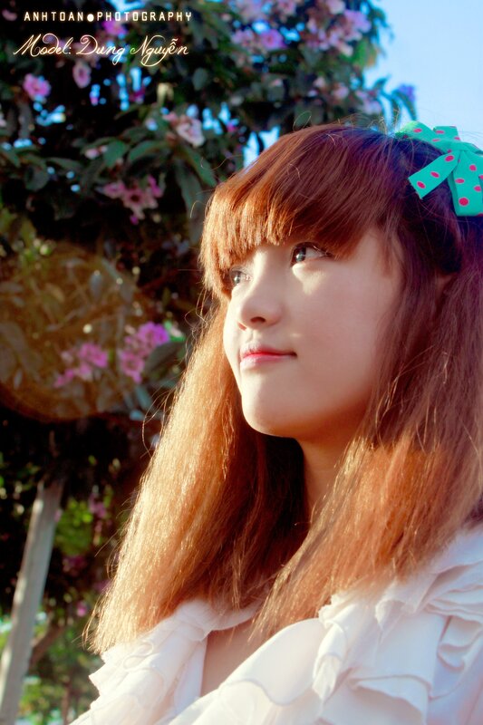Girl with green bow in sunlight