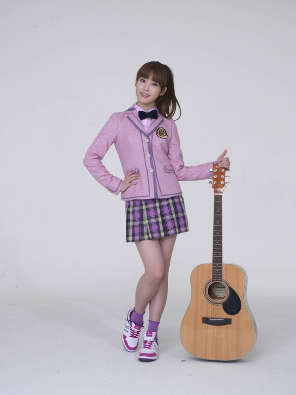girl with guitar in school uniform