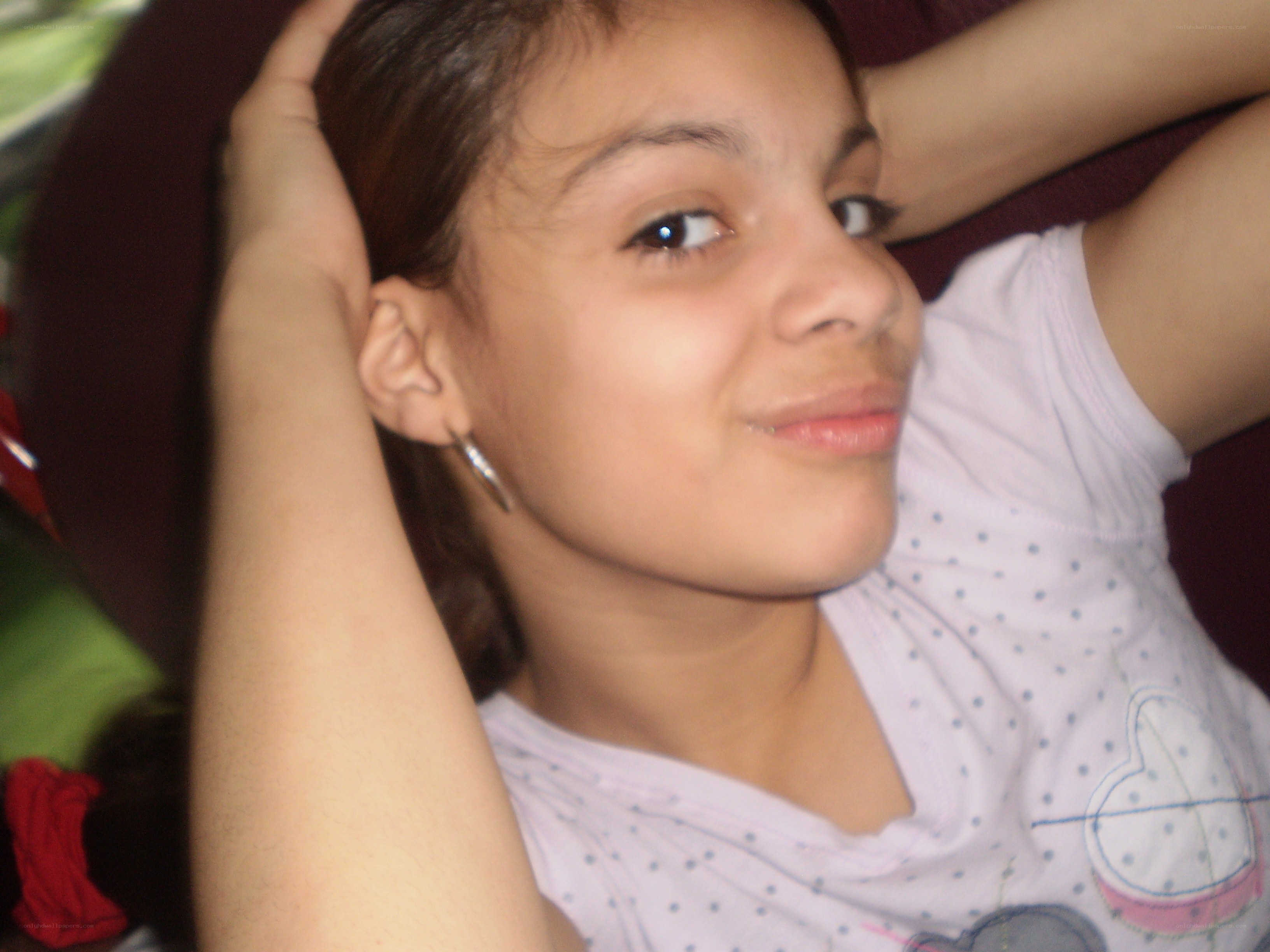 girl with hands behind head