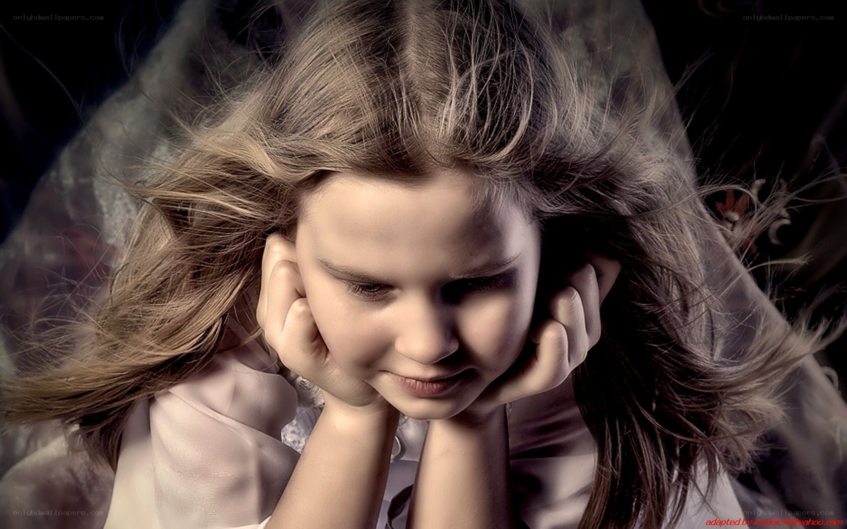girl with hands on cheeks