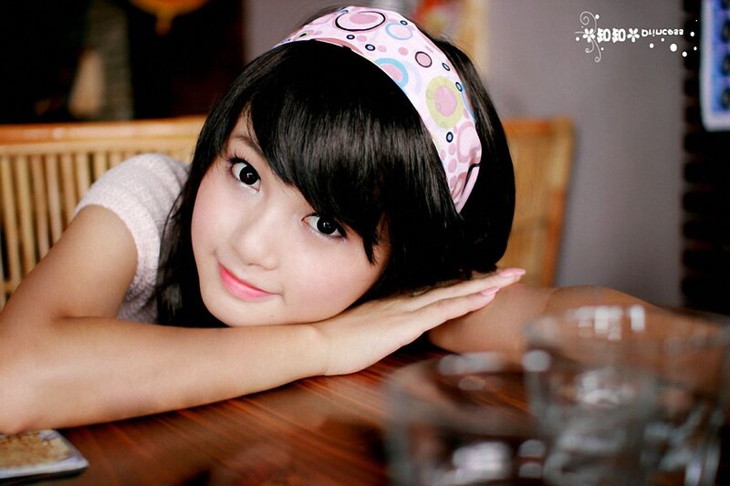 girl with headband smiling