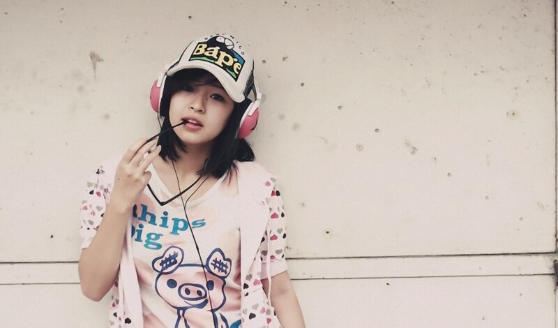 girl with headphones and cap