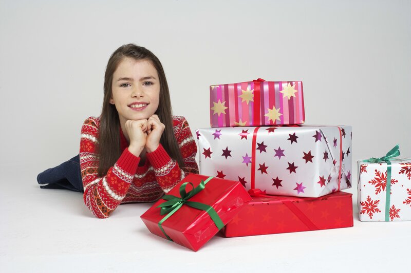 girl with holiday gifts