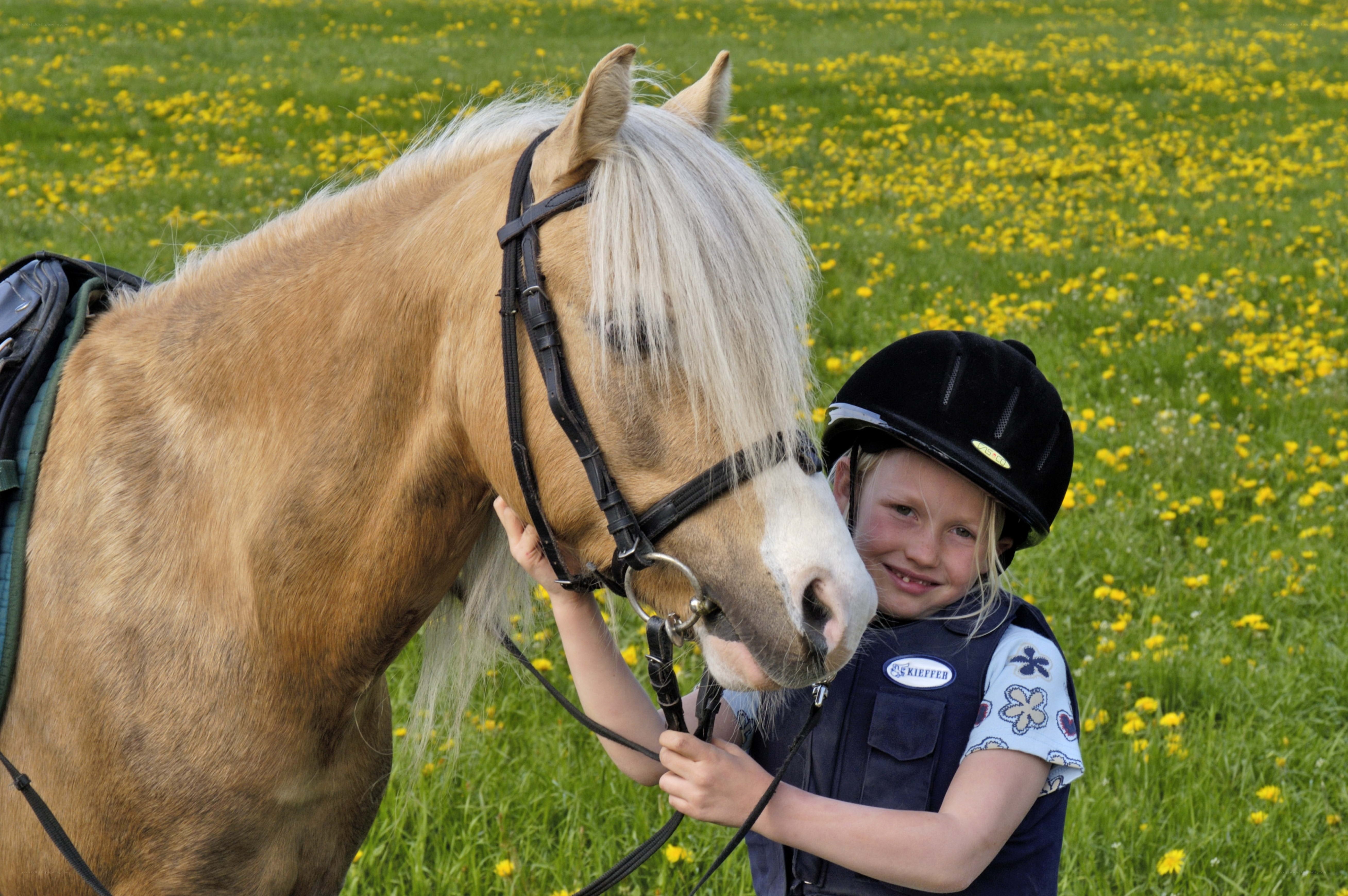 Girl with horse in field