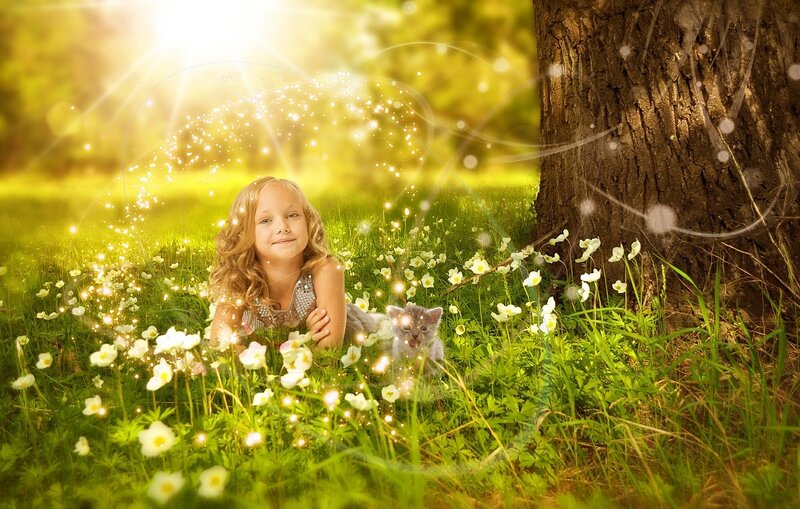 Girl with Kitten in Field