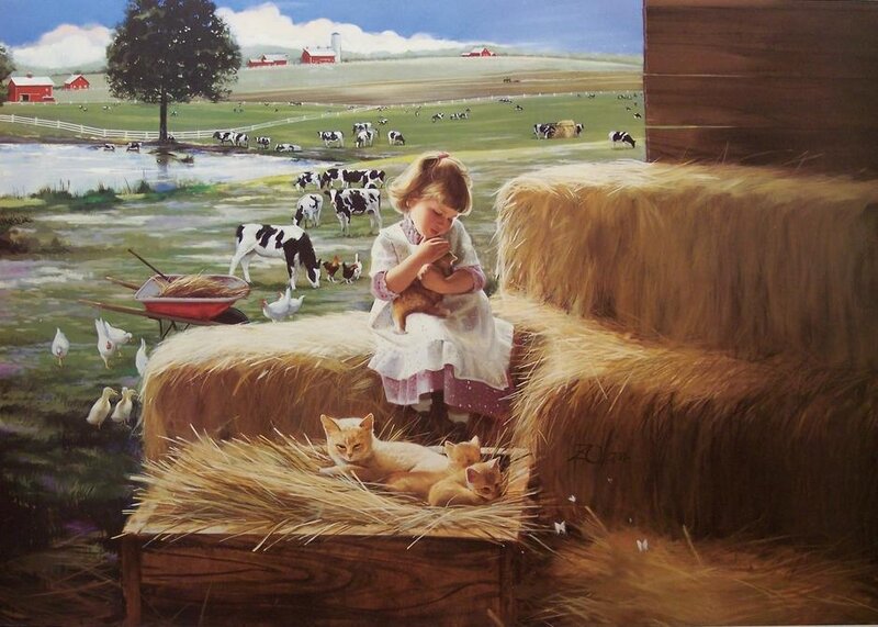 Girl with kittens on a farm