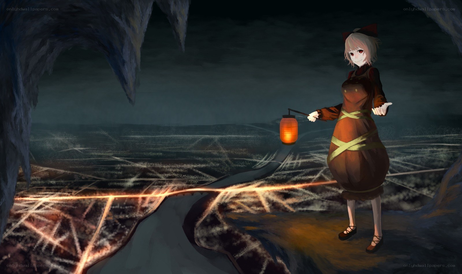 girl with lantern in cave