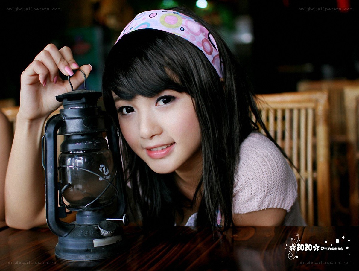 Girl with lantern on table