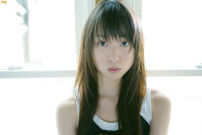 girl with long hair looking at camera