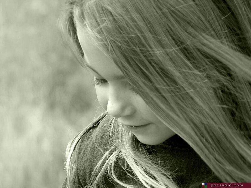 girl with long hair looking down