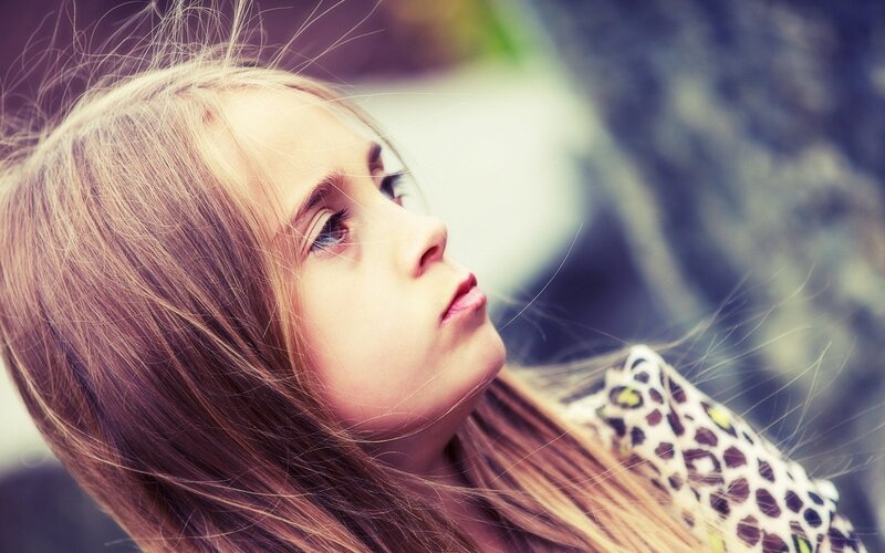 girl with long hair looking up