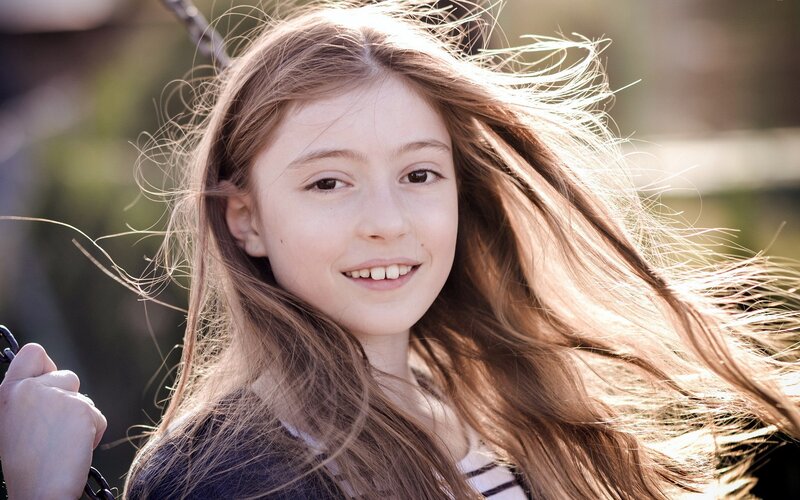 girl with long hair smiling
