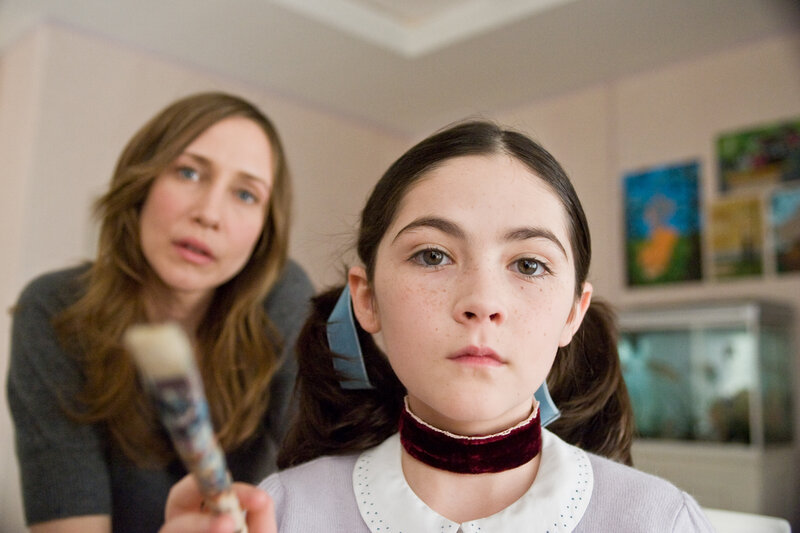 Girl with paintbrush in room