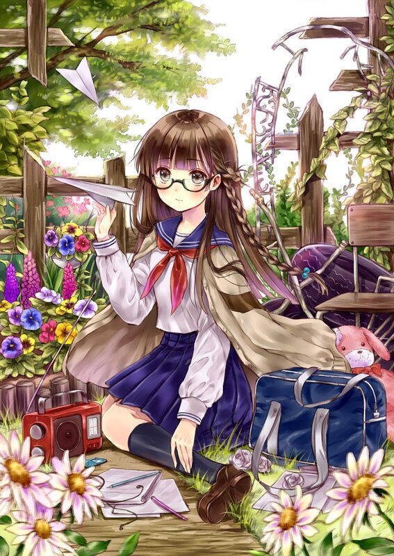 Girl with paper airplane in garden