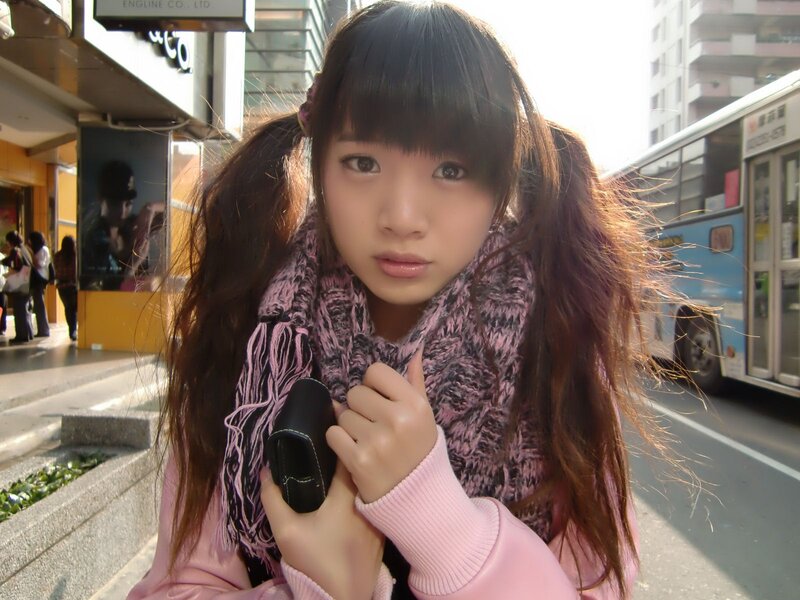 Girl with pigtails on street