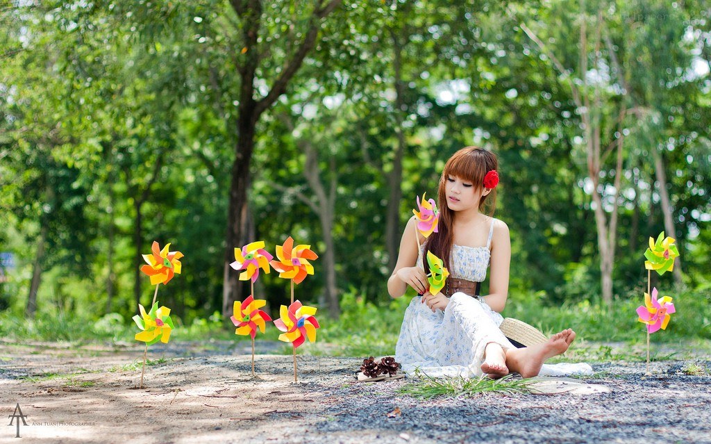 Girl with pinwheels in park
