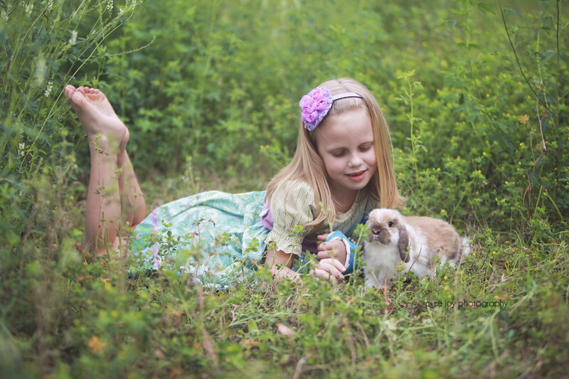 Girl with Rabbit in Grass