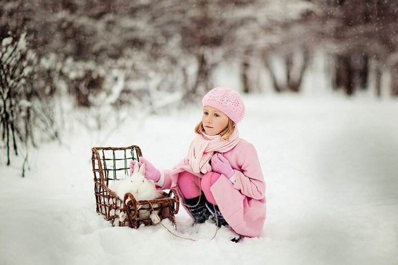Girl with Rabbit in Snow