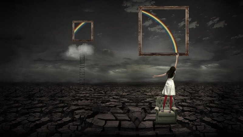 Girl with rainbow in a barren land