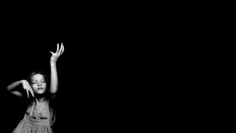 girl with raised hands