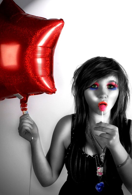 Girl with red balloon and lollipop