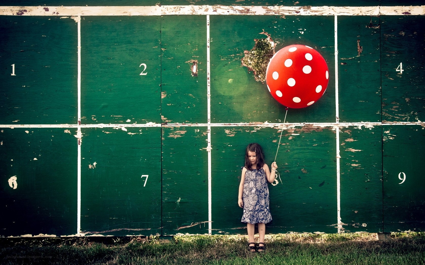 Girl with red balloon