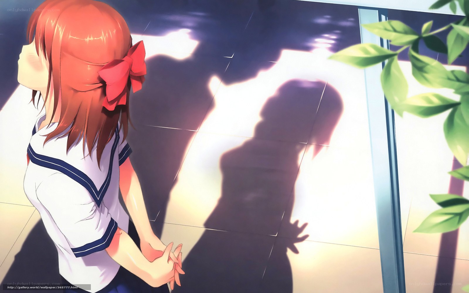 Girl with red bow looking at shadow