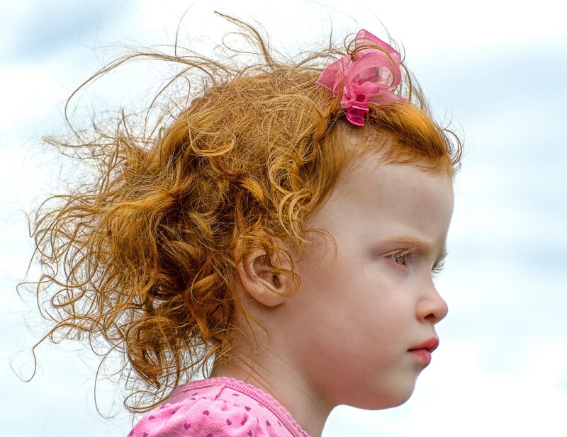 girl with red hair in profile