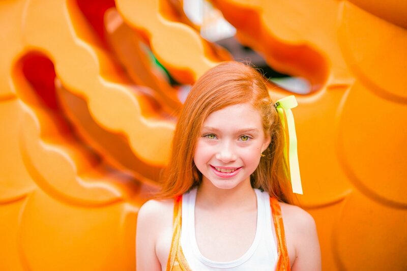 girl with red hair smiling