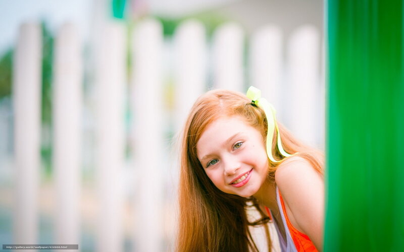 girl with red hair smiling