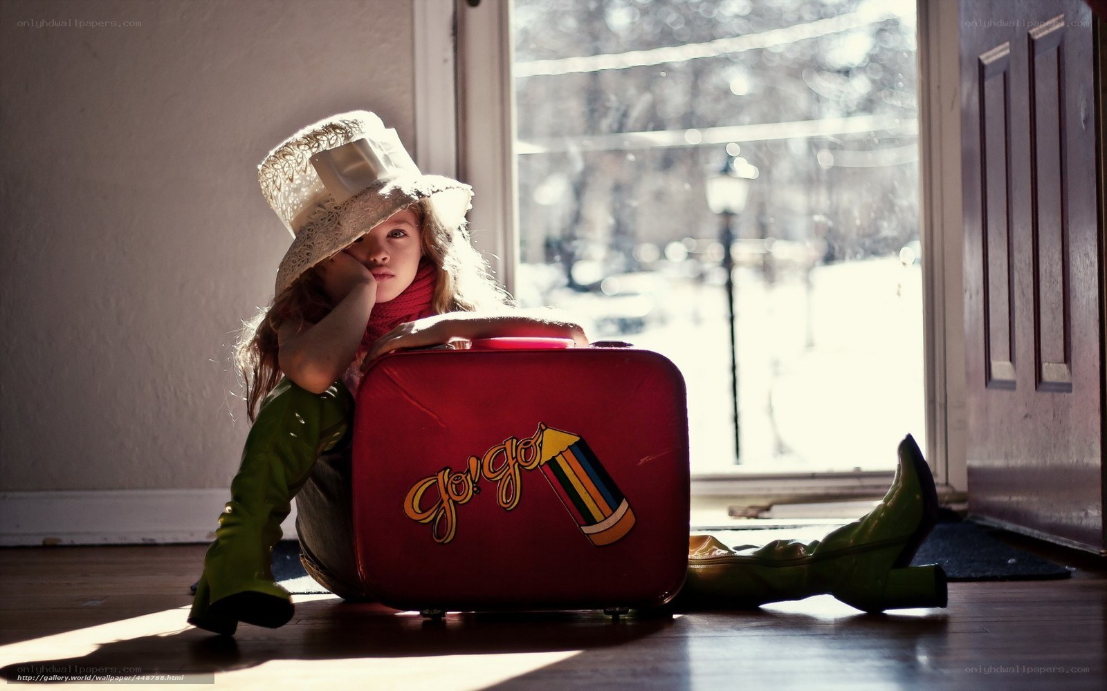 Girl with red suitcase